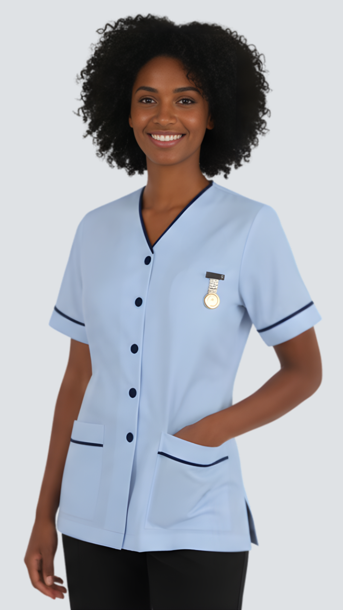 Person wearing a light blue uniform with a badge on a gray background